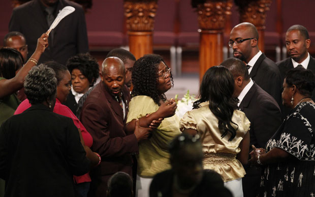 Photo: Beverly Cooper, in yellow, the mother of Aaron Shannon Jr., 5, is comforted during the funeral services at the City of Refuge November 12, 2010. Credit: BarbaraDavidson / The Los Angeles Times