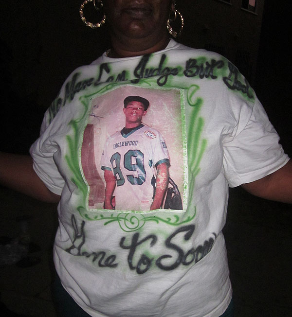 Photo: Tricia Moss wears a memorial T-shirt for her grandson, Marvin Nicholson. Credit: Sarah Ardalani / Los Angeles Times 