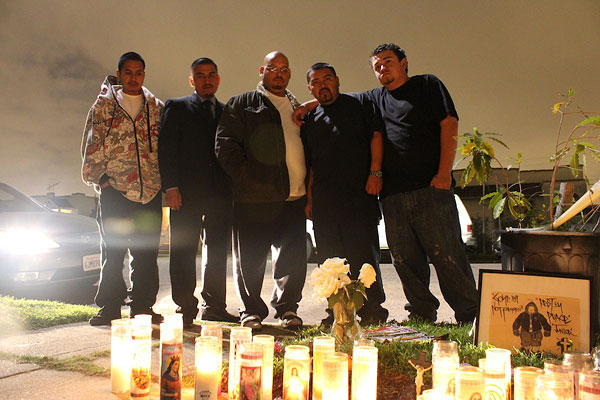 Salvador Medina, Roberto Nava and Manuel Balderas with friends at the Nava/Garcia memorial. Credit: Mary Slosson
