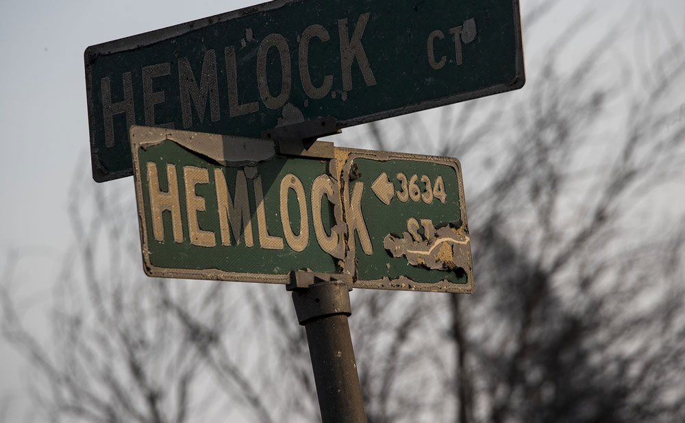 Heat damaged street sign at Hemlock Street and Hemlock Court in Santa Rosa