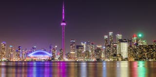 A cityscape view of Toronto at night
