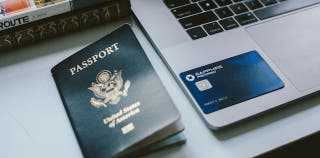Chase credit card on a laptop next to a passport