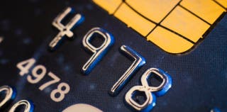 Close-up details of credit card numbers and chip