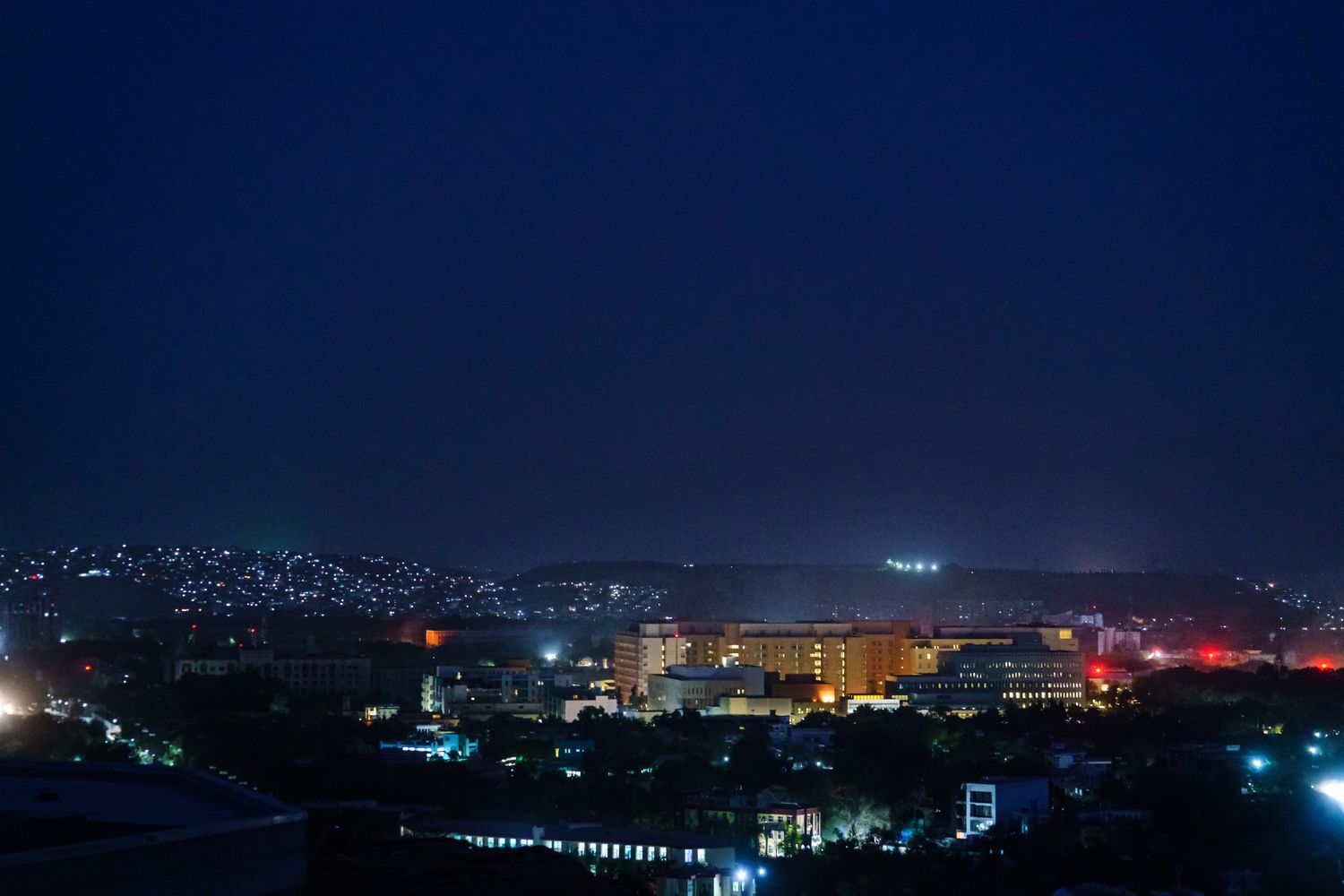 A cityscape view of Kabul at night.