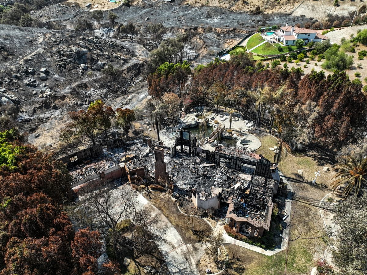 Riverside, CA, Tuesday, July 23, 2024 - A few homes were destroyed, including this one located off Canyon Hill Dr., while dozens others damaged by the Hawarden Fire that burned more than 500 acres of brush through steep canyons surrounding large estate homes.(Robert Gauthier/Los Angeles Times)