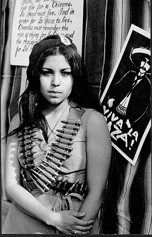 Former Brown Beret Hilda Jensen wearing a bandolier at Lincoln High School