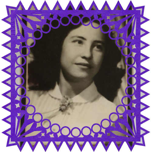 Photo of Abuelita in a frame with papel picado.