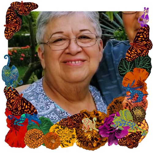 Photo of Abuelita Alma in a frame with marigolds, flowers, alebrijes and monarch butterflies.