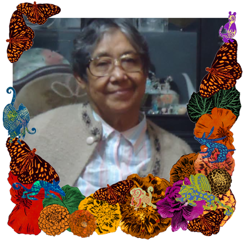 Photo of Abuelita Laura in a frame with marigolds, flowers, alebrijes and monarch butterflies.