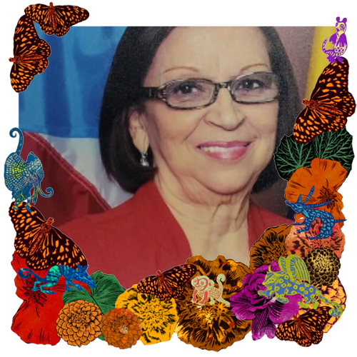 Photo of Abuelita Luz in a frame with marigolds, flowers, alebrijes and monarch butterflies.
