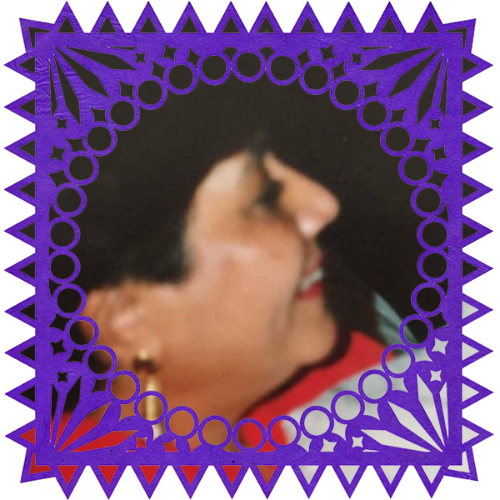 Photo of Abuelita Rosa in a frame with papel picado.