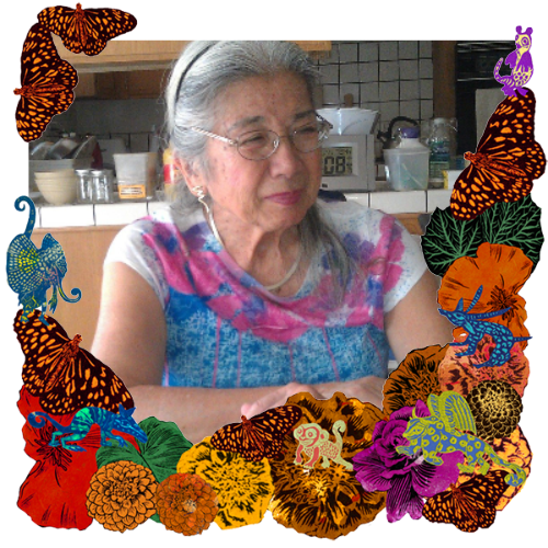 Photo of Aiko Schick in a frame with marigolds, flowers, alebrijes and monarch butterflies.