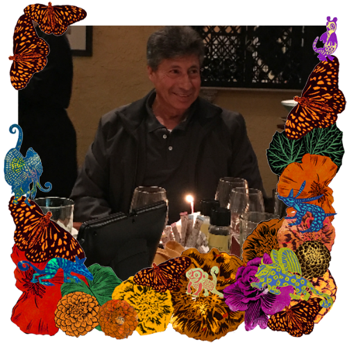 Photo of Angel Rodriguez in a frame with marigolds, flowers, alebrijes and monarch butterflies.
