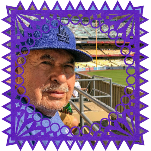 Photo of Mi Apá in a frame with papel picado.