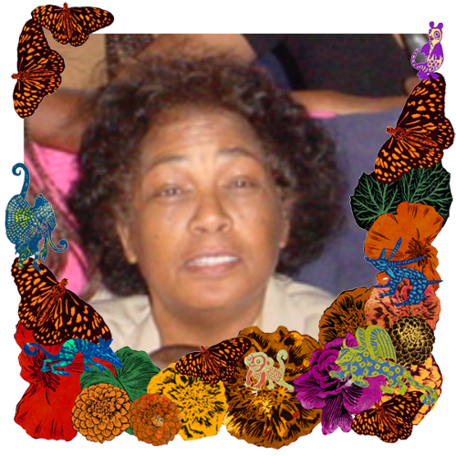 Photo of Barbara in a frame with marigolds, flowers, alebrijes and monarch butterflies.