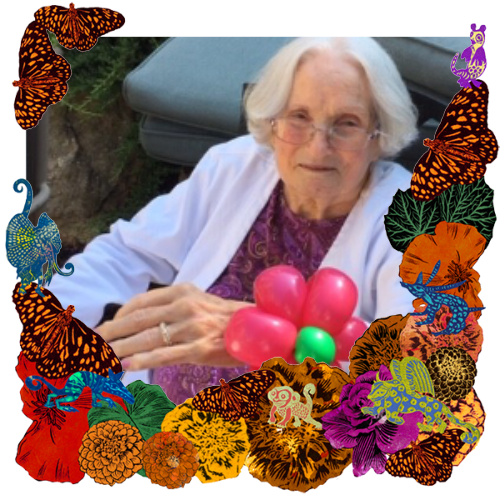 Photo of Betty Ervin in a frame with marigolds, flowers, alebrijes and monarch butterflies.