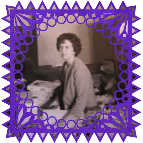 Photo of Betty Ringnell Bock in a frame with papel picado.