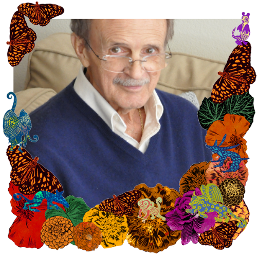 Photo of Bill in a frame with marigolds, flowers, alebrijes and monarch butterflies.
