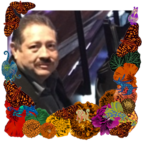 Photo of Brother-in-law in a frame with marigolds, flowers, alebrijes and monarch butterflies.