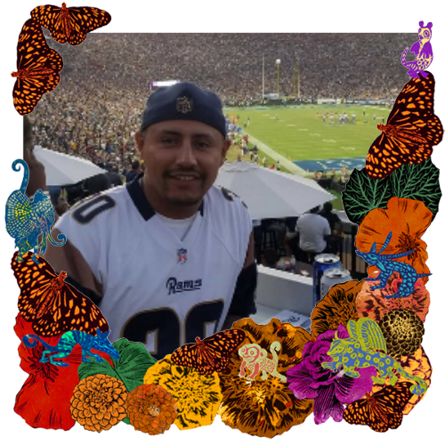 Photo of Carlos Aguilar Cuzo in a frame with marigolds, flowers, alebrijes and monarch butterflies.