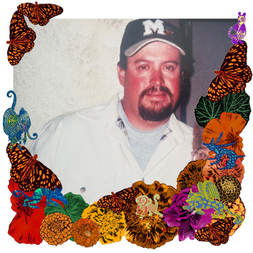 Photo of Carlos Valdez in a frame with marigolds, flowers, alebrijes and monarch butterflies.