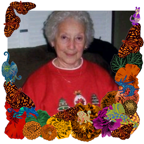 Photo of Carmen Guerrero in a frame with marigolds, flowers, alebrijes and monarch butterflies.