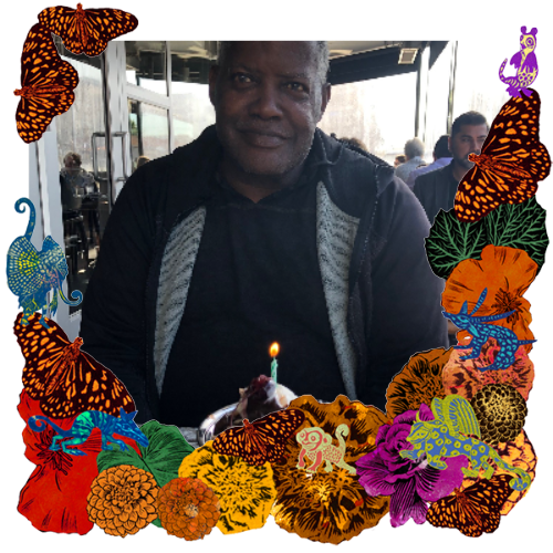 Photo of Charles Thornton in a frame with marigolds, flowers, alebrijes and monarch butterflies.