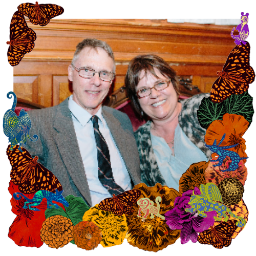 Photo of Dad and Aunt Roxy in a frame with marigolds, flowers, alebrijes and monarch butterflies.