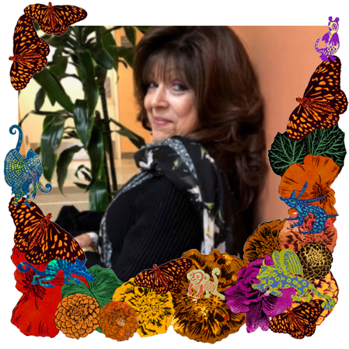 Photo of Dale Felice Liebowitz-Neglia in a frame with marigolds, flowers, alebrijes and monarch butterflies.