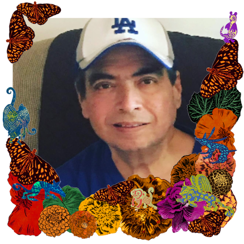 Photo of David Amescua in a frame with marigolds, flowers, alebrijes and monarch butterflies.