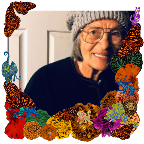 Photo of Dolores Gallego in a frame with marigolds, flowers, alebrijes and monarch butterflies.