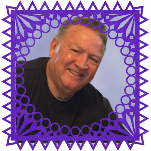 Photo of Don Pennington in a frame with papel picado.