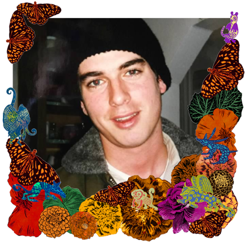 Photo of Dr. Michael Bauer in a frame with marigolds, flowers, alebrijes and monarch butterflies.