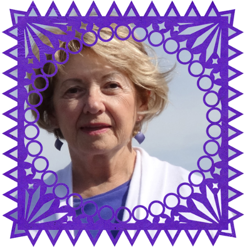 Photo of Elizabeth Kalifon in a frame with papel picado.