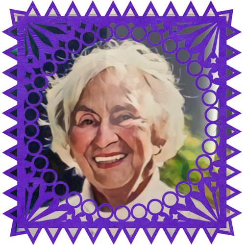 Photo of Elsie in a frame with papel picado.
