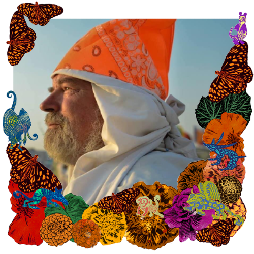 Photo of Erich Laskowski in a frame with marigolds, flowers, alebrijes and monarch butterflies.
