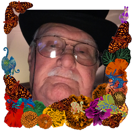 Photo of George Oswell in a frame with marigolds, flowers, alebrijes and monarch butterflies.