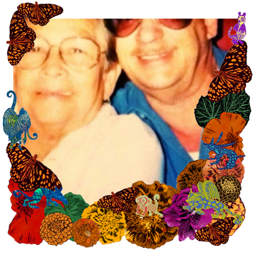 Photo of Grandpa John and Granma Francis in a frame with marigolds, flowers, alebrijes and monarch butterflies.