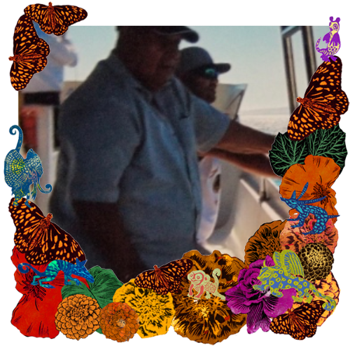 Photo of Guadalupe Orozco in a frame with marigolds, flowers, alebrijes and monarch butterflies.