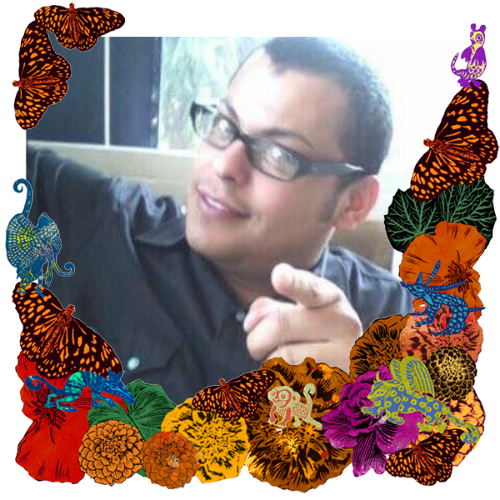 Photo of Hector (Satya) Vazquez Robles in a frame with marigolds, flowers, alebrijes and monarch butterflies.