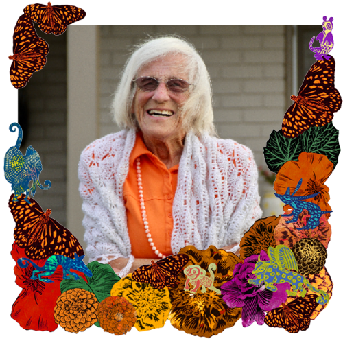 Photo of Helen Bost Ditte in a frame with marigolds, flowers, alebrijes and monarch butterflies.