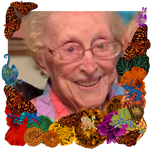 Photo of Helen Johnson in a frame with marigolds, flowers, alebrijes and monarch butterflies.
