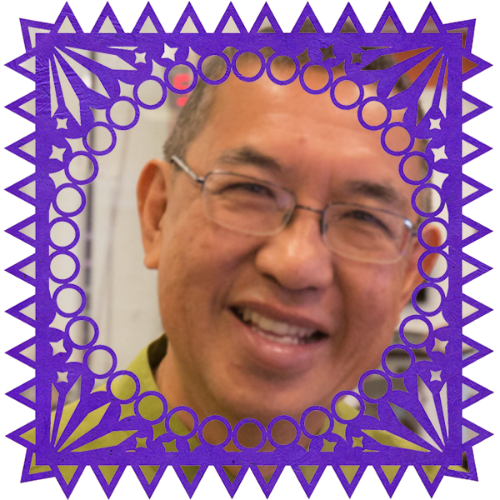 Photo of Henry Ong in a frame with papel picado.