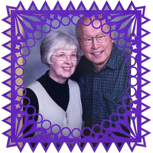 Photo of Henry and Patricia Lee in a frame with papel picado.