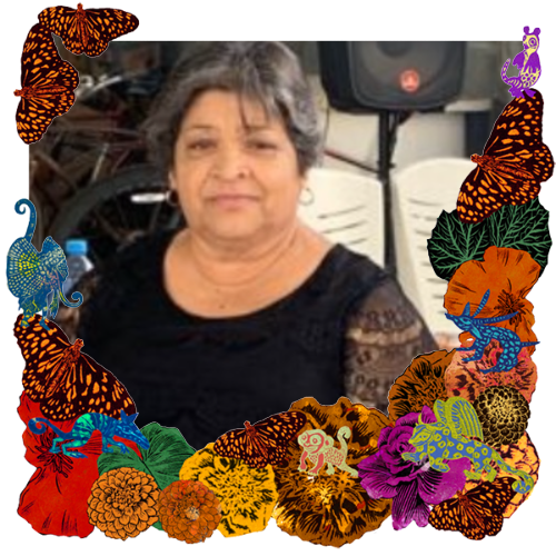Photo of Hilda Fernandez Garza in a frame with marigolds, flowers, alebrijes and monarch butterflies.