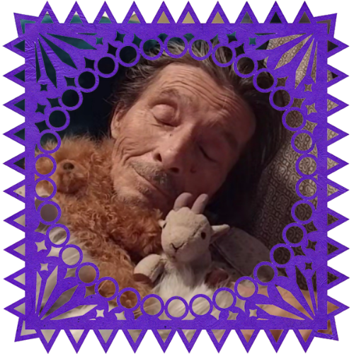 Photo of Husband Ron in a frame with papel picado.