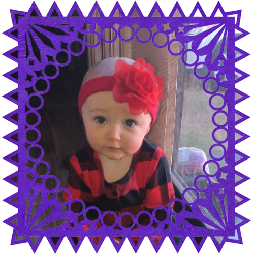 Photo of Izzy Dale in a frame with papel picado.