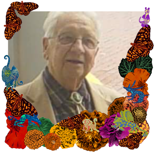 Photo of JW Stogner in a frame with marigolds, flowers, alebrijes and monarch butterflies.