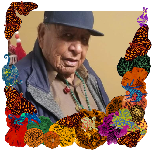 Photo of James Henry De La Rosa in a frame with marigolds, flowers, alebrijes and monarch butterflies.