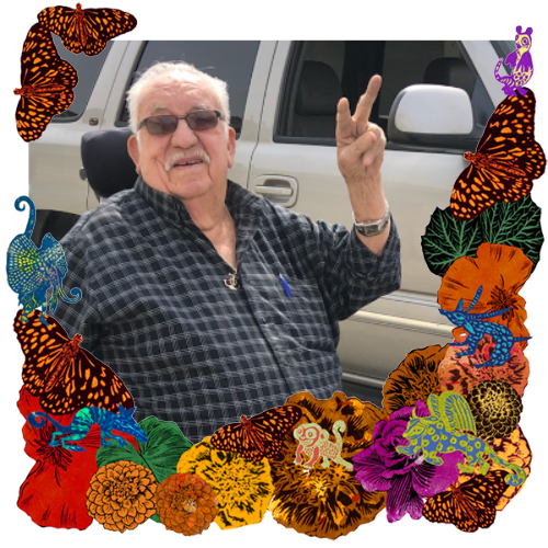 Photo of Jesus Herrera in a frame with marigolds, flowers, alebrijes and monarch butterflies.